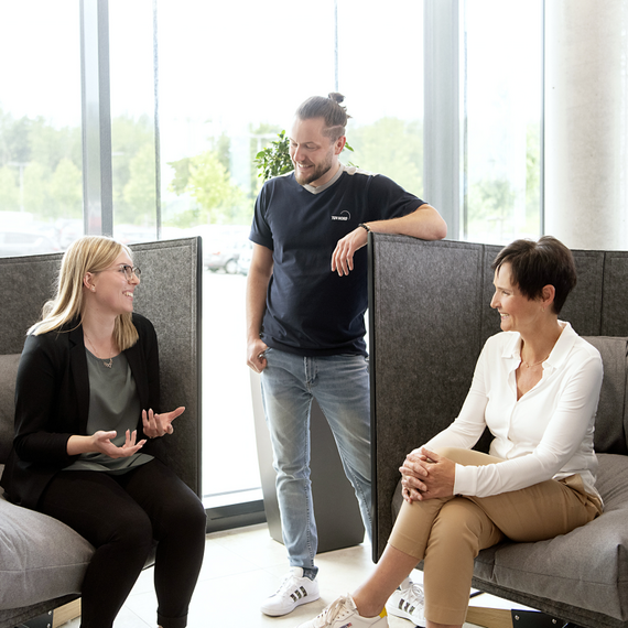 Three colleagues sitting together and talking