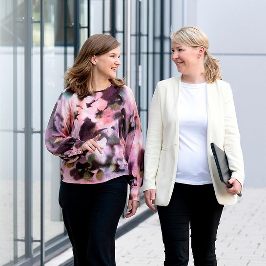 Two female colleagues walking