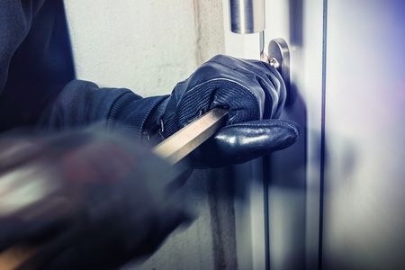 masked burglars breaking and entering into a victim's home
