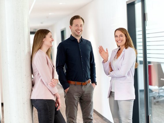 Group of three colleagues in a floor