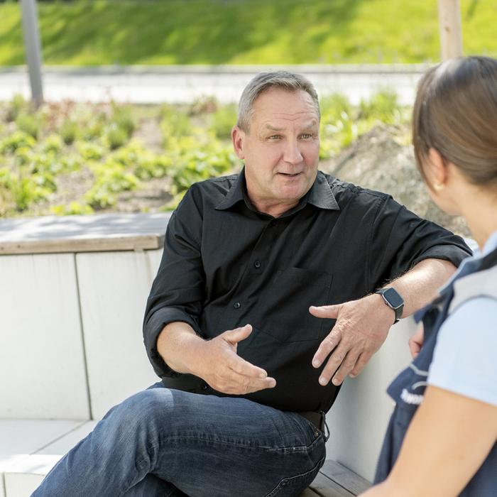 A man talking to a women