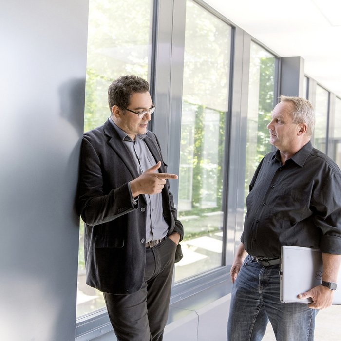 Two male colleagues talking